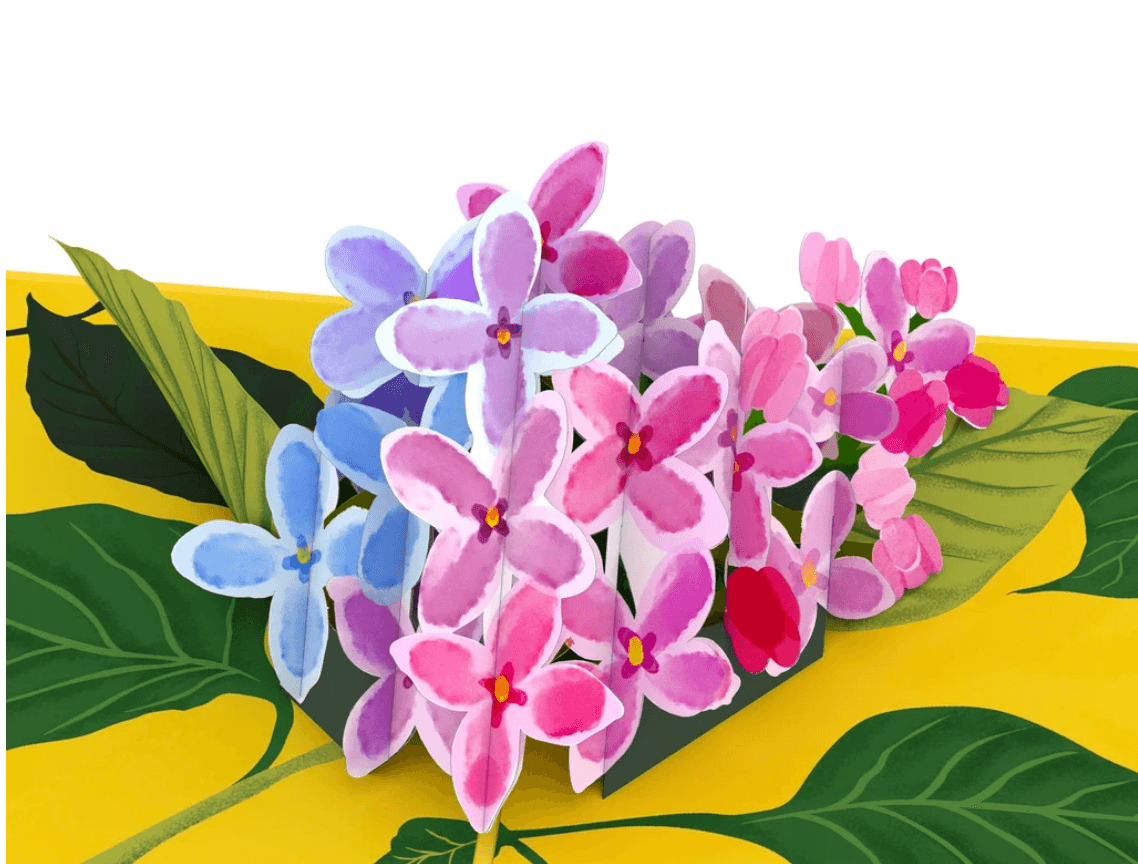 A vibrant arrangement of colorful watercolor flowers on a tropical leaf background, showcasing pink and blue hues.