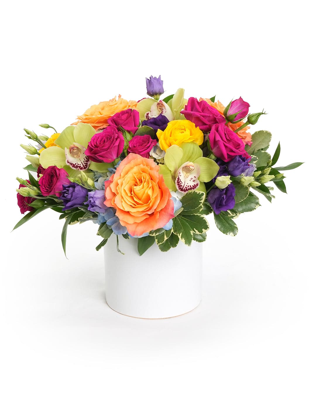 Vibrant floral arrangement with roses, orchids, and vibrant greenery in a stylish white vase.