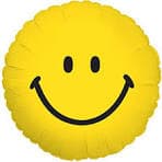 Bright yellow smiley face pillow perfect for adding cheer to any room or as a fun gift option.